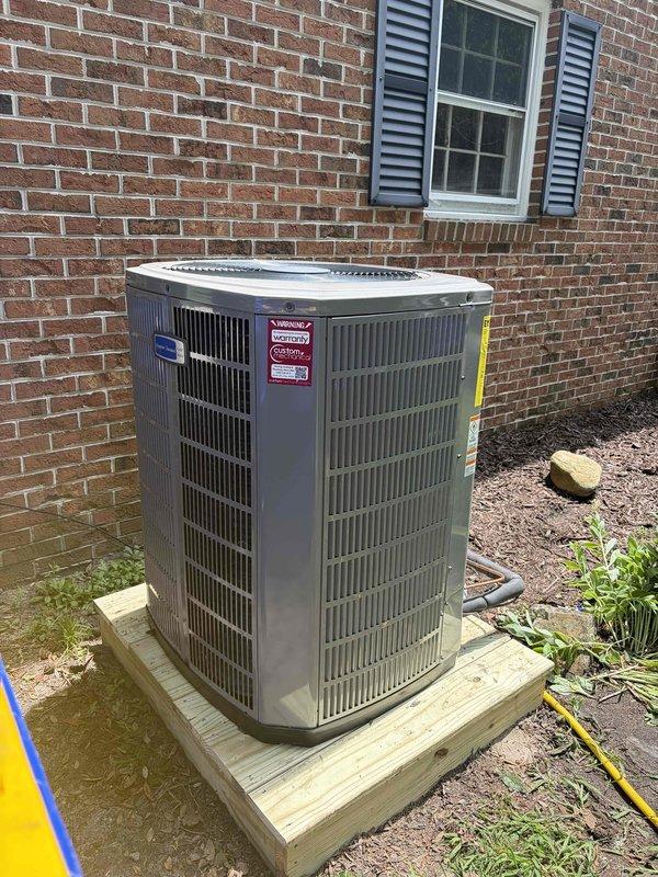 Completed full HVAC system replacement including removal and disposal of existing equipment. Installed 3-ton 17 SEER heat pump outdoor unit on wooden platform against brick exterior with proper electrical disconnect and conduit. Indoor installation consisted of variable speed fan coil unit mounted in drain pan with shutoff valve, 15KW electric heat strip with dedicated breaker, 1-inch filter rack, and automatic condensation pump for reliable drainage. Flushed, pressure tested, and recharged refrigeration lines to manufacturer specifications. Installed electrical whip and disconnect for outdoor unit. System completed with WiFi-enabled thermostat for remote temperature control and monitoring. Extended maintenance contract by one year for continued system coverage. All equipment tested and operational upon completion.
