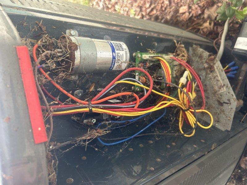 Responded to no cooling call and found outdoor unit not operating. Upon inspection, discovered heavy accumulation of organic debris including leaves, pine needles, and twigs throughout the condenser compartment, restricting airflow and preventing proper unit operation. Cleaned debris from unit interior, inspected capacitor and electrical connections for damage, and verified all wiring remained intact. Unit restored to proper cooling operation after cleaning and testing.