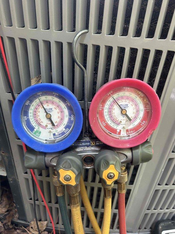 # HVAC Service Completed

Responded to no cooling callback on residential air conditioning system less than 10 years old. Upon arrival, performed diagnostic testing using digital multimeter to measure electrical parameters. Recorded compressor amperage draw of 52.7 amps during inrush testing to verify proper motor operation and rule out electrical failure.

Connected refrigerant manifold gauge set to service ports and measured system pressures on both high and low sides to assess refrigerant charge and overall system performance. Evaluated pressure readings against manufacturer specifications to determine if system was operating within normal parameters or experiencing refrigerant-related issues.

Diagnostic testing completed to identify root cause of repeat no cooling condition and determine appropriate corrective action.