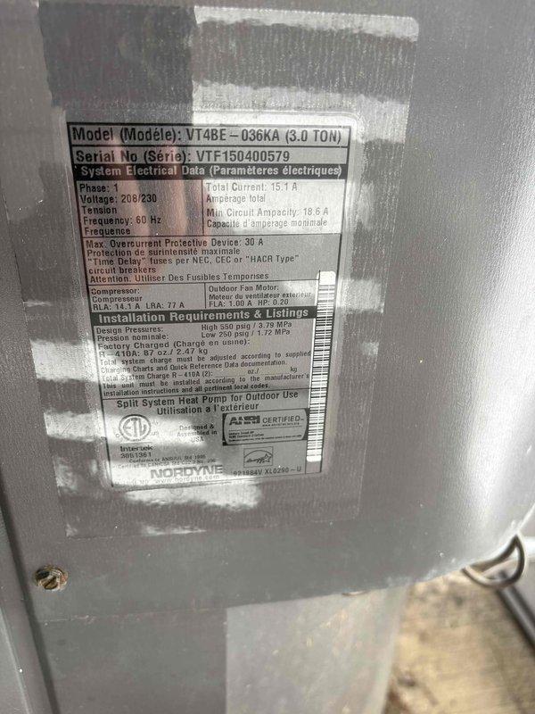 Responded to no cooling call on Nordyne VT4BE-036KA 3.0 ton heat pump system that had been running on auxiliary heat for approximately one week with constant operation. Upon arrival, verified thermostat displaying 73°F in cooling mode with system call active. Inspected outdoor unit and confirmed model specifications and electrical ratings at 208/230V, 60Hz, 15.1A total current draw. Diagnosed system failure preventing compressor operation, forcing unit to rely solely on auxiliary heat strips during cooling demand, resulting in excessive runtime and improper temperature control.