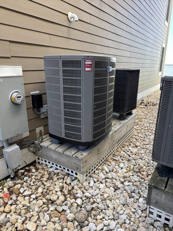 Completed full HVAC system replacement including removal and disposal of existing equipment. Installed American Standard 5A6H4042A1000A 3.5-ton 14 SEER heat pump outdoor unit on existing platform with new outdoor disconnect and electrical whip. Installed American Standard 5TEM6D04AV31 variable speed air handler with 10kw electric heat pack and BAYSF1235 filter rack. Fabricated and installed metal duct transitions to adapt new equipment to existing ductwork. Reused existing electrical connections, condensate drain lines, and refrigerant line sets. Installed Honeywell TH6320WF digital WiFi thermostat for system control. Performed system startup, verified proper operation of all components, and conducted diagnostic testing to ensure optimal performance. System includes one-year platinum maintenance agreement covering both heating and cooling equipment.
