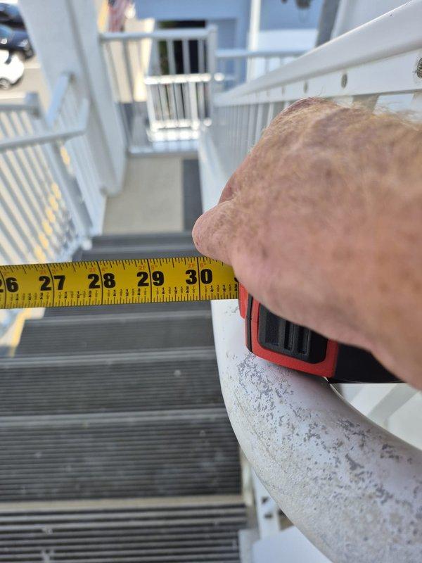 Responded to no cooling call on residential HVAC system with 5-degree temperature differential between setpoint and actual room temperature. Upon arrival, confirmed air handler was operating and delivering airflow but system was not producing cool air. Performed diagnostic inspection of rooftop condenser unit located on exterior balcony platform. Measured refrigerant line diameter and assessed overall system condition. Unit showed signs of age-related wear with weathered components and accumulated debris on surfaces. Documentation photos captured for service records and proposal revision purposes.