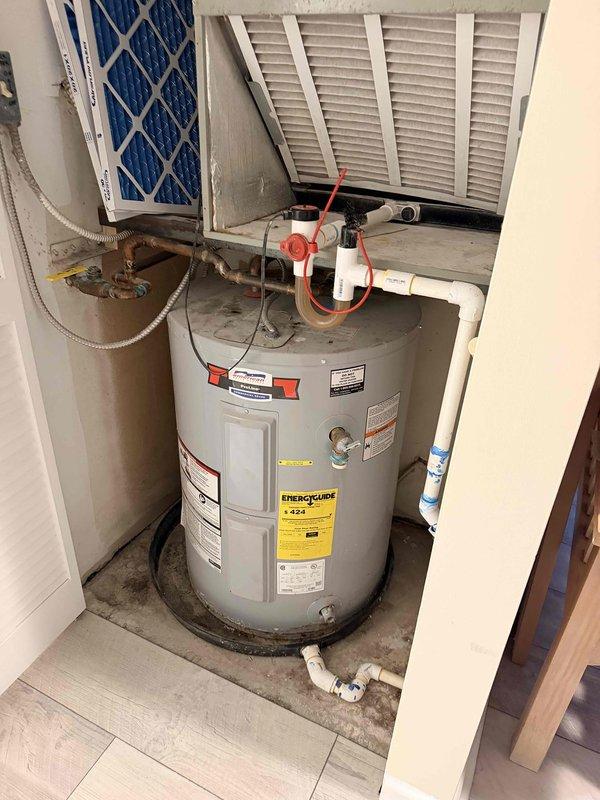 Completed on-site assessment for full HVAC system replacement and water heater replacement. The existing heating and cooling unit located in the hall closet is non-operational and requires complete replacement. Additionally, evaluated the American ProLine water heater for replacement, documenting current installation conditions including all piping connections, venting configuration, and utility room layout to provide comprehensive replacement estimate.