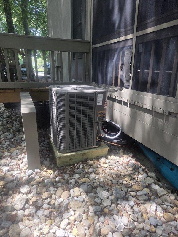 Completed full HVAC system replacement including removal and disposal of existing equipment. Installed Lennox ML14KP1-030 2.5-ton 14 SEER heat pump on pressure-treated wood platform beneath residential deck with river rock landscaping base. Mounted Lennox CBK45UHET-030 air handler in interior utility closet alongside laundry appliances. Integrated Lennox 10kW electric heat pack into system. Fabricated and installed metal duct transitions to adapt new equipment to existing ductwork. Replaced outdoor disconnect and electrical whip while reusing existing electrical service, condensation drain lines, and power connections. Installed Honeywell TH6320WF digital WiFi thermostat for system control. Verified all refrigerant line connections, electrical connections, and system operations. Unit includes filter at air handler and is covered under one-year parts and labor warranty from installation date.