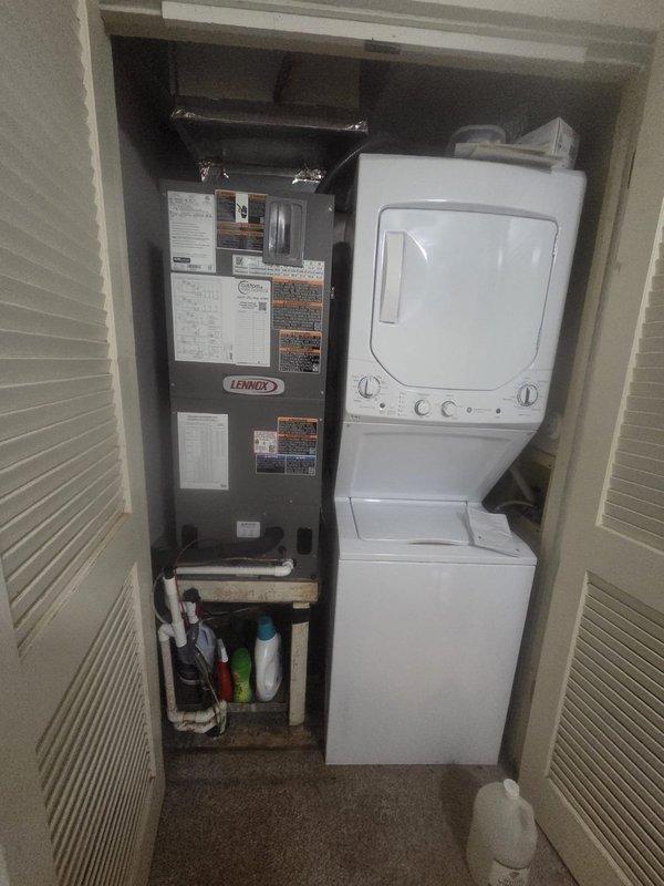 Completed full HVAC system replacement including removal and disposal of existing equipment. Installed Lennox ML14KP1-030 2.5-ton 14 SEER heat pump on pressure-treated wood platform beneath residential deck with river rock landscaping base. Mounted Lennox CBK45UHET-030 air handler in interior utility closet alongside laundry appliances. Integrated Lennox 10kW electric heat pack into system. Fabricated and installed metal duct transitions to adapt new equipment to existing ductwork. Replaced outdoor disconnect and electrical whip while reusing existing electrical service, condensation drain lines, and power connections. Installed Honeywell TH6320WF digital WiFi thermostat for system control. Verified all refrigerant line connections, electrical connections, and system operations. Unit includes filter at air handler and is covered under one-year parts and labor warranty from installation date.