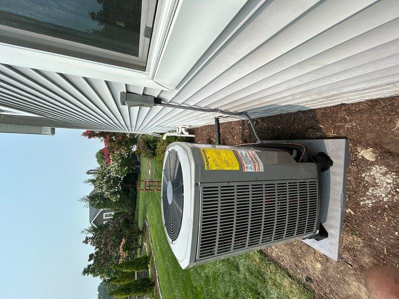 Removed and disposed of existing package unit. Fabricated and installed metal duct transitions to adapt existing ductwork to new equipment. Installed large central ducted return in living room routed through closet for improved air circulation. Reused existing electrical service, condensation drain line, and power supply connections to minimize modifications.

Installed American Standard 5A6H70361000 3-ton 17 SEER two-stage heat pump outdoor unit on plastic pad with snow legs for proper drainage and seasonal protection. Replaced outdoor disconnect and electrical whip to meet current code requirements. Mounted American Standard 5TXCB006 evaporator coil inside with media filter housing at unit. Installed Nexia 824 smart thermostat for system control and remote monitoring capabilities.

Completed system startup, charged refrigerant to manufacturer specifications, and verified proper operation of two-stage heating and cooling functions. System tested and operational with all safety control