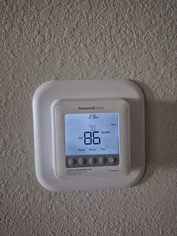 Responded to no cooling complaint at rental property. Upon arrival, found thermostat displaying 86°F with system calling for cooling. Performed system diagnostics and measured supply air temperature at floor register, which indicated inadequate cooling output. Documented static pressure readings using digital manometer showing 3508 reading. Verified thermostat operation and confirmed system was running in cooling mode with fan set to auto. Captured diagnostic measurements and system conditions for further evaluation of cooling deficiency.