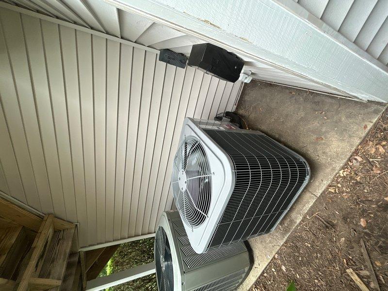 Completed full HVAC system replacement including removal and disposal of existing equipment. Installed 27SCA536 3-ton 14.3 SEER heat pump outdoor unit on 3-inch risers atop existing concrete pad with new whip and disconnect. Installed FJ5ANXC42 fan coil unit with 15KW heater and breaker in drain pan with shut-off valve. Replaced 15 feet of heat-damaged 12-inch return flex duct in attic space. Flushed, pressure tested, and recharged refrigeration lines to manufacturer specifications, confirming proper system operation with readings of 22 degrees superheat. Integrated existing EcoBee thermostat with new equipment. System commissioned and verified operational for single-system residence under new one-year service contract.