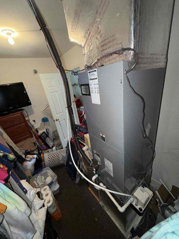 # HVAC Service Report

Responded to no cooling complaint at residential property. Upon arrival, accessed utility closet and inspected air handler/furnace unit. System evaluation revealed failed evaporator coil with visible refrigerant leak. Coil had deteriorated beyond repair, causing complete loss of cooling capacity. Removed defective evaporator coil assembly and disposed of failed component outside per EPA refrigerant handling protocols. Recommended complete coil replacement to restore system functionality. Unit requires new evaporator coil installation and refrigerant recharge to return to operational status.