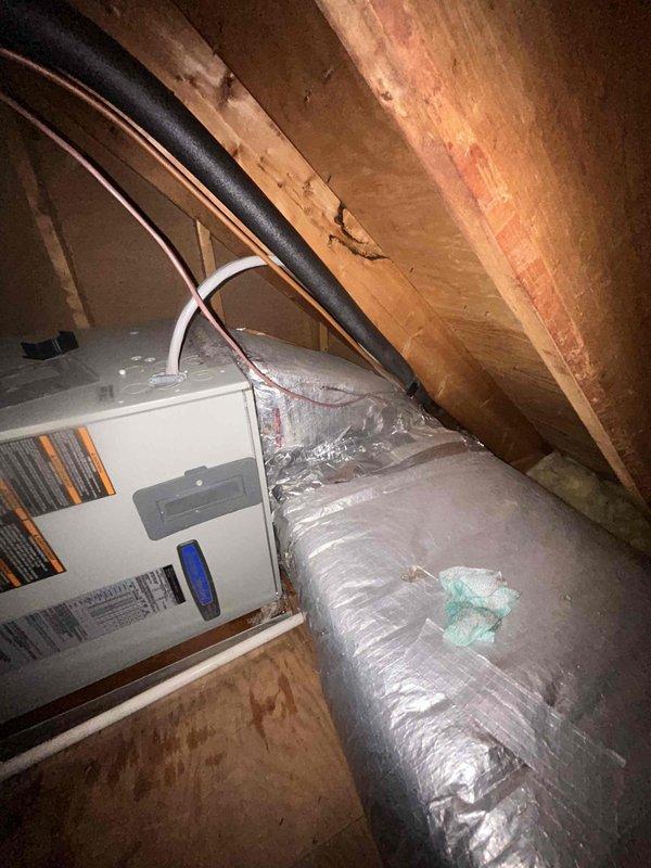 Responded to no cooling complaint with indoor temperature at 83°F despite both central HVAC system and living room mini-split running continuously. Upon inspection of outdoor condenser unit and attic-mounted air handler, diagnosed low refrigerant charge affecting system capacity. Evacuated remaining refrigerant, performed leak check, repaired leak, and recharged system to manufacturer specifications, restoring proper cooling operation and airflow throughout the residence.