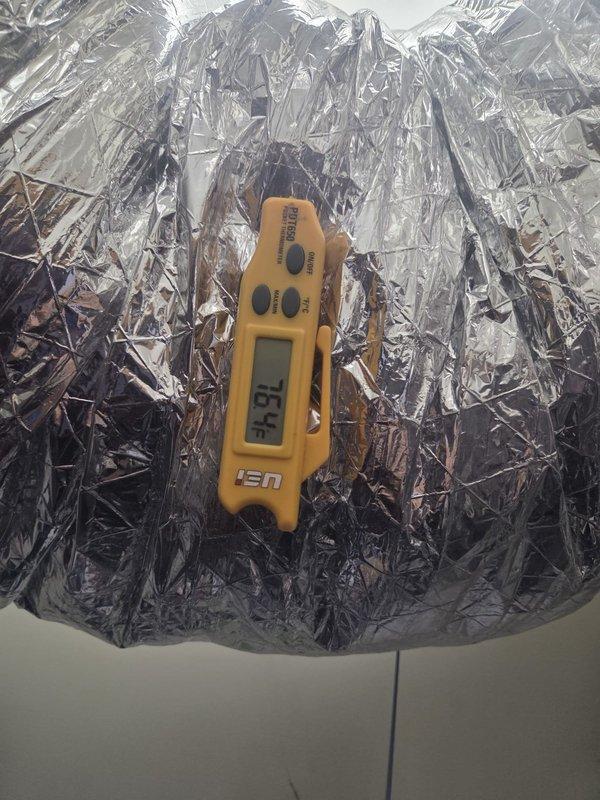 Responded to no cooling complaint on second floor system. Upon arrival, measured supply air temperature at ductwork in attic space, recording 52.1°F at supply plenum and 73°F return air temperature, indicating adequate temperature split and proper system operation. System achieving designed cooling capacity with appropriate airflow across evaporator coil.