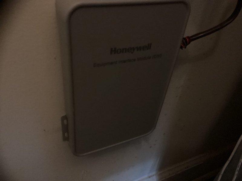 Conducted on-site estimate for complete HVAC system replacement of existing 13-year-old equipment. Evaluated current furnace and air handler unit located in mechanical room, noting existing ductwork configuration with mixed insulation coverage and documented Honeywell equipment interface module for system compatibility assessment.