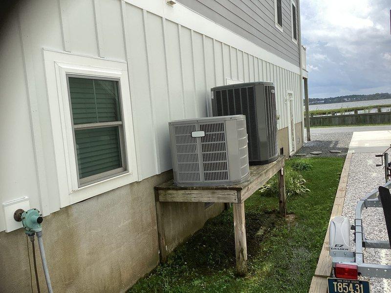 Conducted site assessment for mini split installation in detached storage space behind garage to provide climate control. Evaluated existing electrical infrastructure including main breaker panel with adequate capacity and circuit availability. Documented current HVAC equipment placement and exterior mounting locations to determine optimal positioning for new mini split condenser unit and indoor air handler for the storage area.