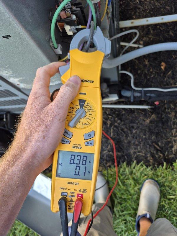 Completed preventative maintenance cooling visit on one of two systems at property. Performed comprehensive system inspection and diagnostics using digital multimeter to verify proper electrical operation. Measured voltage readings at outdoor unit showing 838V and amperage draw of 63.1A, confirming unit operating within normal parameters. Inspected all electrical connections, wiring terminals, and conduit for proper installation and secure connections. Verified system cooling performance and confirmed equipment functioning correctly with no issues identified.