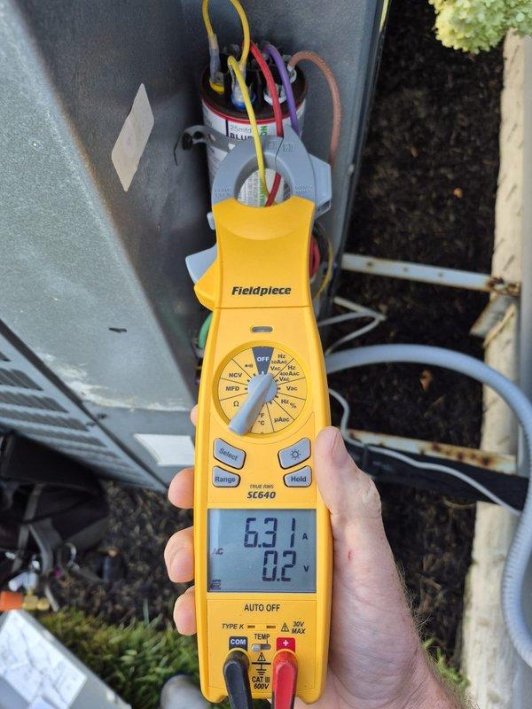 Completed preventative maintenance cooling visit on one of two systems at property. Performed comprehensive system inspection and diagnostics using digital multimeter to verify proper electrical operation. Measured voltage readings at outdoor unit showing 838V and amperage draw of 63.1A, confirming unit operating within normal parameters. Inspected all electrical connections, wiring terminals, and conduit for proper installation and secure connections. Verified system cooling performance and confirmed equipment functioning correctly with no issues identified.