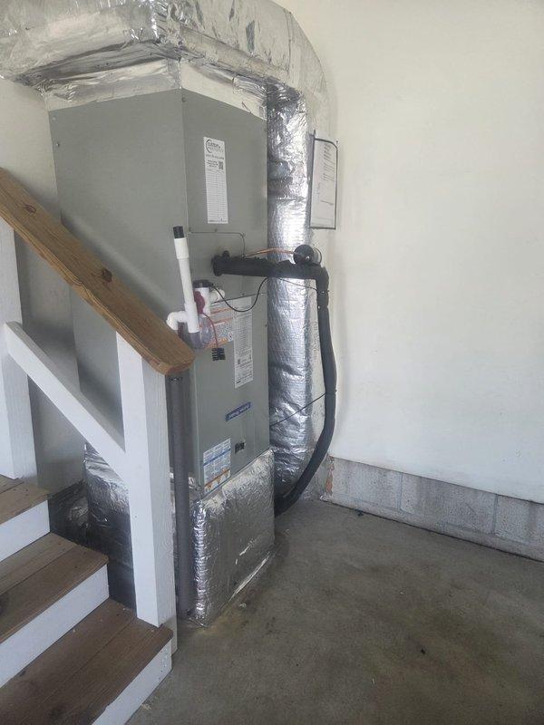 Completed full HVAC system replacement in residential utility space. Removed and disposed of existing equipment. Installed American Standard 5A6H4036A1000 3-ton 14 SEER heat pump with outdoor unit positioned on pressure-treated wood platform. Installed American Standard 5TEM4D04AV air handling unit with ECM motor in garage area, along with American Standard BAYHTR1510 10kw electric heat pack for supplemental heating. Fabricated and installed metal duct transitions to adapt new equipment to existing ductwork system. Reused existing condensate drain lines and electrical power supply where applicable. Replaced outdoor disconnect and electrical whip to meet current code requirements. Installed Honeywell Digital WiFi Thermostat for system control and remote access capability. Connected refrigerant lines between indoor and outdoor units with proper insulation. Verified all electrical connections, tested system operation across heating and cooling modes, and confirmed proper airflow through d