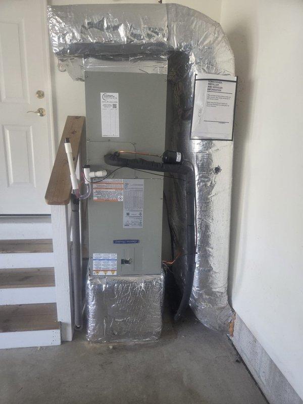 Completed full HVAC system replacement in residential utility space. Removed and disposed of existing equipment. Installed American Standard 5A6H4036A1000 3-ton 14 SEER heat pump with outdoor unit positioned on pressure-treated wood platform. Installed American Standard 5TEM4D04AV air handling unit with ECM motor in garage area, along with American Standard BAYHTR1510 10kw electric heat pack for supplemental heating. Fabricated and installed metal duct transitions to adapt new equipment to existing ductwork system. Reused existing condensate drain lines and electrical power supply where applicable. Replaced outdoor disconnect and electrical whip to meet current code requirements. Installed Honeywell Digital WiFi Thermostat for system control and remote access capability. Connected refrigerant lines between indoor and outdoor units with proper insulation. Verified all electrical connections, tested system operation across heating and cooling modes, and confirmed proper airflow through d