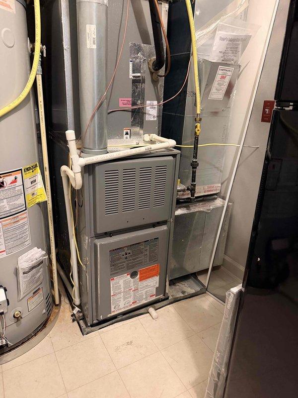 Responded to service call for HVAC unit with reported system leak located on second floor. Upon inspection of mechanical room, evaluated existing furnace, ductwork, water heater, and associated gas lines and copper piping. Documented current equipment configuration including metallic ductwork, insulated copper lines, and electrical components. Provided comprehensive estimate for complete system replacement to address leak and ensure proper operation of heating equipment.