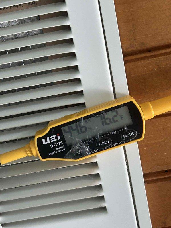 Responded to no-cool call for upstairs unit not reaching setpoint with condensate drainage issue. Upon arrival, measured supply air temperature at 57.3°F and return air temperature at 79.5°F, confirming adequate temperature split and proper refrigerant charge. Identified primary issue as clogged condensate drain line preventing proper drainage. Cleared condensate line obstruction, verified proper drainage flow, and confirmed system cooling operation. Unit restored to normal operation with proper airflow and condensate removal.