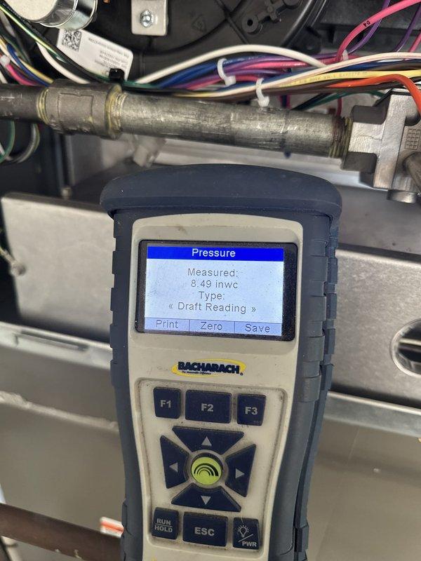 Removed and disposed of existing furnace equipment. Installed one Lennox EL297DF090XV60CK variable speed gas furnace with ECM blower motor. Fabricated and installed metal duct transitions to adapt new unit to existing ductwork. Reused existing electrical connections, condensate drain lines, and power supply. Performed combustion analysis and verified draft pressure readings at 8.49 inches water column and 1.70 inches water column to ensure proper venting operation. System tested and operational. This installation follows recent heat pump and coil replacement where faulty gas valve was identified. One-year service contract initiated from installation date.