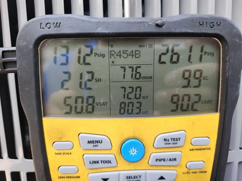 Completed full HVAC system replacement including removal and disposal of existing equipment. Installed 5A6H7048 4-ton 17 SEER heat pump outdoor unit on existing platform with new electrical whip and disconnect. Installed 5TEM6D06 variable speed fan coil unit indoors with BAYHTR1715BRKR 15KW electric heat strip and breaker. Flushed, pressure tested, and recharged refrigeration lines to manufacturer specifications. Installed 1-inch filter rack and THX1200W WiFi thermostat for system control. System startup and commissioning completed with all parameters verified within normal operating range. Diagnostic readings confirmed proper refrigerant charge, superheat, and subcooling values. Both outdoor units operational and mounted securely on wooden platform with proper electrical connections and conduit routing along exterior wall.