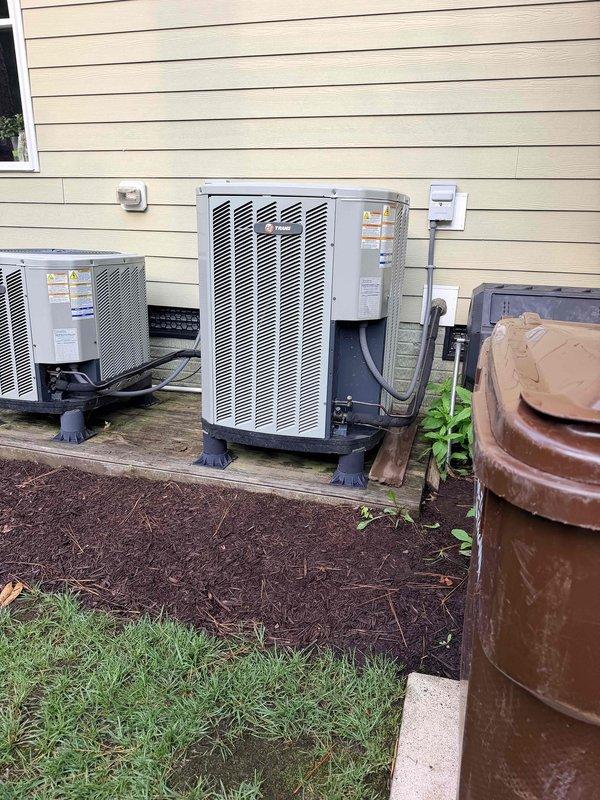 Completed estimate for replacement of existing HVAC system. Evaluated current outdoor equipment configuration consisting of multiple units mounted on pads against exterior wall, assessed electrical connections and refrigerant lines, and documented existing Trane equipment specifications. Provided customer with replacement options and recommendations for new system installation.