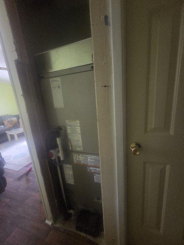 Completed full HVAC system replacement including removal and disposal of existing equipment. Installed new Carrier 27SCA536A003 3-ton 15 SEER heat pump outdoor unit positioned on pressure-treated wood platform. Mounted Carrier FT5ANBC36L00 variable speed air handler in interior utility closet with integrated Carrier FF2601C10 10kW electric heat kit for supplemental heating. Fabricated and installed metal duct transitions to adapt new equipment to existing ductwork system. Reused existing refrigerant lines and condensate drain piping where serviceable. Replaced outdoor disconnect and electrical whip to meet current code requirements. Installed new Honeywell TH6320WF digital WiFi thermostat with programmable controls mounted on interior wall. Verified all electrical connections, tested system operation across heating and cooling modes, and confirmed proper airflow through existing ductwork. Equipment change from originally specified manufacturer was accommodated per homeowner preference 