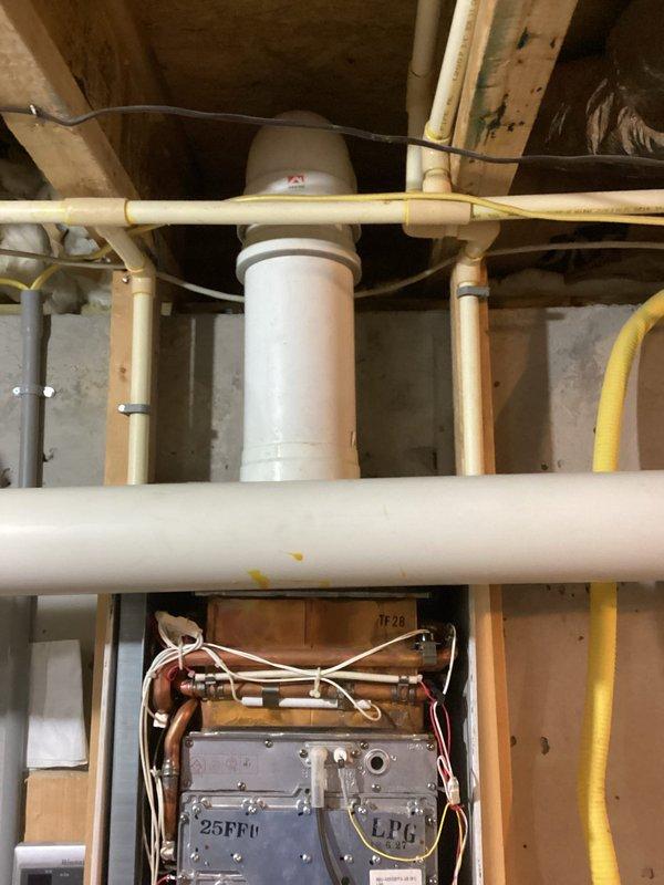 Completed preventive maintenance on tankless water heater unit including inspection of gas connections, electrical components, and venting system. Verified proper operation of all internal components, checked yellow gas line connections for leaks, and confirmed PVC exhaust and intake piping integrity. Unit tested and left in proper working condition.