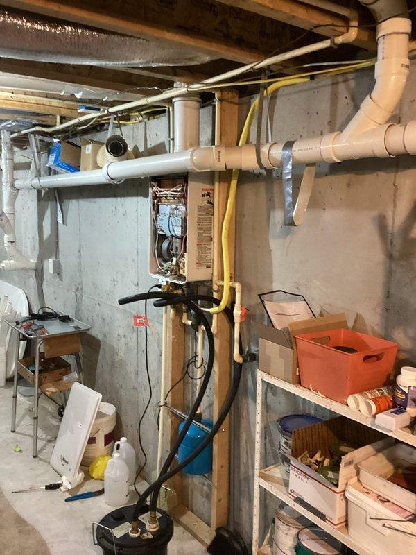 Completed preventive maintenance on tankless water heater unit including inspection of gas connections, electrical components, and venting system. Verified proper operation of all internal components, checked yellow gas line connections for leaks, and confirmed PVC exhaust and intake piping integrity. Unit tested and left in proper working condition.