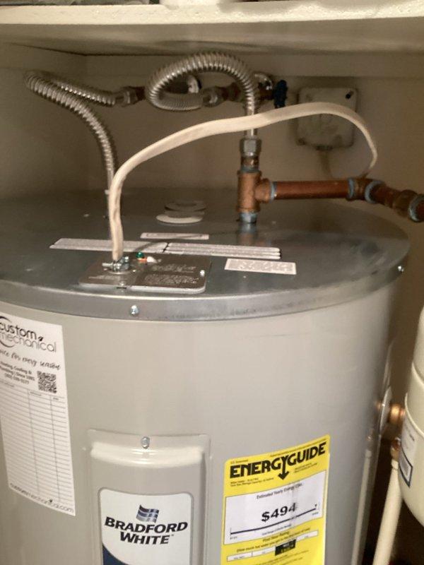 Removed and replaced existing water heater with Bradford White 50-gallon lowboy unit (model RE250L61). Installation included 28-inch drain pan, expansion tank, two 18-inch flexible water connectors, brass fittings (3/4" x 4" nipple, 3/4" x 6" nipple, 3/4" 90-degree elbow, 3/4" tee), and high-temperature male adapters. All plumbing connections secured with proper fittings and tested for leaks. Unit installed in utility closet space on platform base with adequate clearance. Verified proper venting, temperature/pressure relief valve operation, and all safety controls functioning correctly.

Additionally installed two replacement toilets and disposed of old units per customer request.