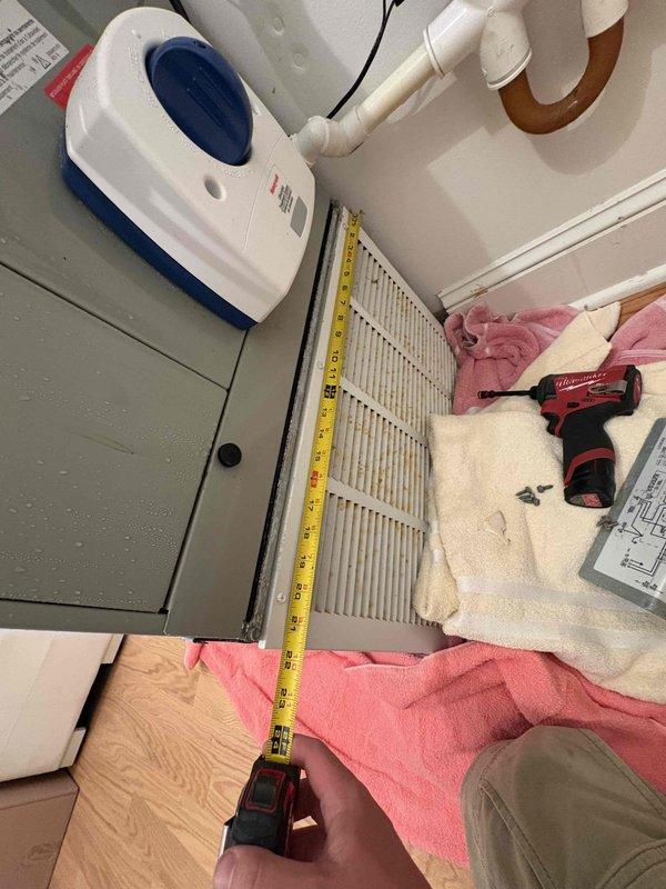 Responded to no cooling complaint on third floor air handler unit. Upon arrival, found ice formation on indoor coil indicating restricted airflow or low refrigerant condition. Instructed occupant to turn system off and set fan to continuous operation to allow ice to thaw. Performed diagnostic measurements of air handler and electrical components. Evaluated condensate pump operation and drainage system. Inspected air filter for restrictions that could contribute to coil icing. Documented equipment dimensions and electrical readings for further analysis once coil has fully defrosted.