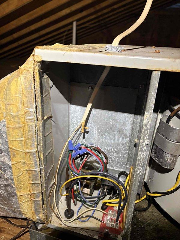 Responded to emergency no-cool call for 35-year-old Tempstar air conditioning system at residential property. Upon arrival, found outdoor condensing unit operational but not providing adequate cooling. Accessed attic-mounted air handler and removed electrical control panel cover to inspect internal components and wiring connections. Evaluated system's overall condition, noting significant age-related wear on both indoor and outdoor equipment. Documented equipment nameplate information and photographed electrical components, control wiring, and blower assembly for service records. After thorough inspection of the aging system, discussed findings with customer regarding the unit's advanced age and available options for repair versus replacement considerations given the equipment's 35-year service life exceeding typical industry standards.