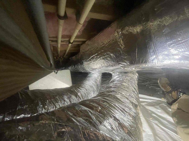 Completed full geothermal HVAC system installation including removal and disposal of existing ductwork. Installed new insulated metal trunk duct with flexible supply and return branches throughout attic and crawl space areas. Mounted Geostar G5SZ036 split geothermal unit with G5BM036 fan coil unit in closet using downflow configuration. Installed TPCC32U03WGSR thermostat for system control and ran all necessary refrigeration lines, condensate drain, and low voltage wiring between indoor and outdoor units. Performed system flush and startup procedures to verify proper operation. Applied 10-year extended warranty coverage to equipment.