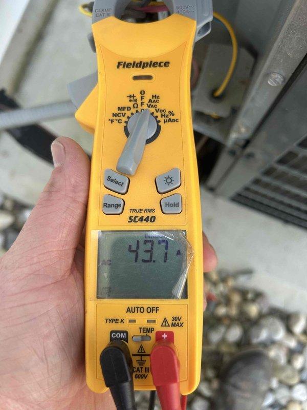 # HVAC Cooling System Maintenance and Diagnostics

Performed comprehensive cooling maintenance visit on residential HVAC system. Conducted electrical diagnostics using clamp meter to verify system performance and operational parameters. Measured voltage readings at 437.7V and amperage draw at 89.7A on outdoor condensing unit components. Inspected compressor, electrical connections, and refrigerant lines for proper operation. Verified capacitor function and overall system electrical integrity. System tested and operating within normal parameters upon completion of service visit.