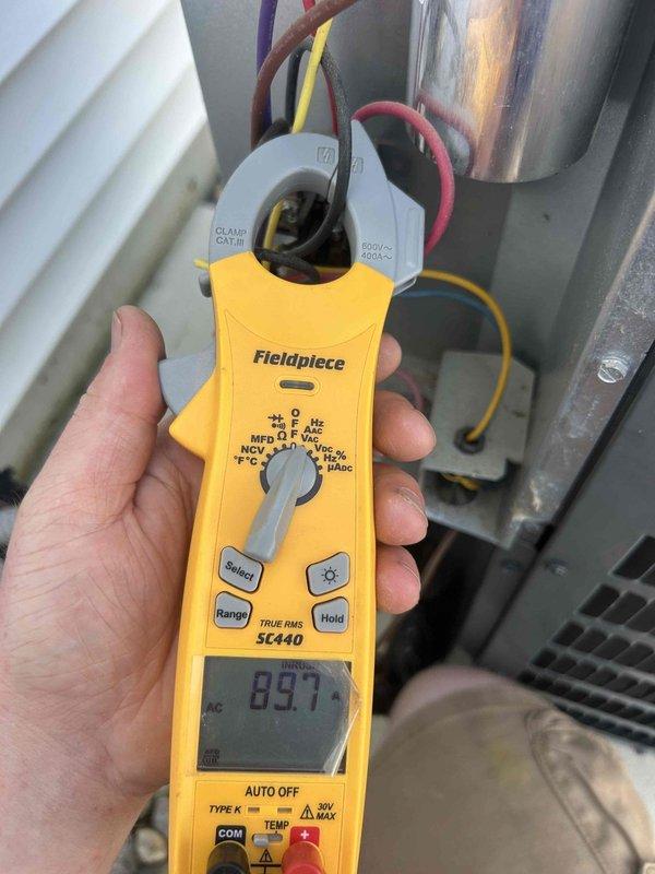 # HVAC Cooling System Maintenance and Diagnostics

Performed comprehensive cooling maintenance visit on residential HVAC system. Conducted electrical diagnostics using clamp meter to verify system performance and operational parameters. Measured voltage readings at 437.7V and amperage draw at 89.7A on outdoor condensing unit components. Inspected compressor, electrical connections, and refrigerant lines for proper operation. Verified capacitor function and overall system electrical integrity. System tested and operating within normal parameters upon completion of service visit.