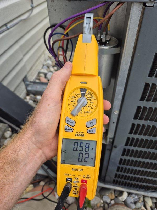 # HVAC Maintenance - Cooling System Service

Completed routine cooling maintenance visit on residential HVAC system. Performed comprehensive system inspection including supply air temperature measurements at ceiling register, recording 53.54°F outlet temperature. Conducted electrical diagnostics at condensing unit, measuring 0.58 amps current draw and 0.2 volts across capacitor connections using digital multimeter. Verified proper operation of all electrical components, inspected wiring connections, and confirmed system is operating within normal parameters. All measurements indicate system is functioning efficiently with no issues identified.