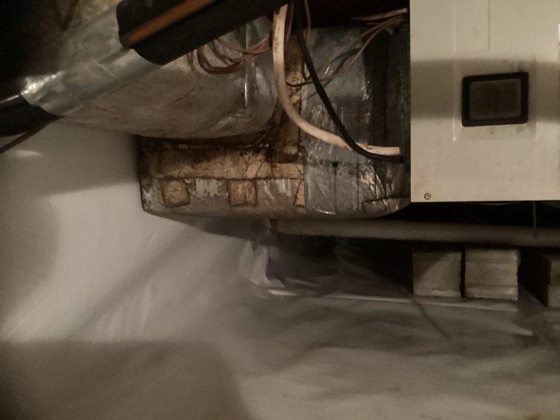 Responded to service call for 12-year-old HVAC system with identified refrigerant leak on U-bend of condenser coil. Performed comprehensive system evaluation and documented existing equipment condition, noting significant deterioration and rust on interior components. Provided complete replacement estimate as requested by homeowner, including discussion of repair versus replacement options. Explained that repair attempt would carry no guarantee due to age and condition of existing equipment. Documented system with photographs for estimate purposes.