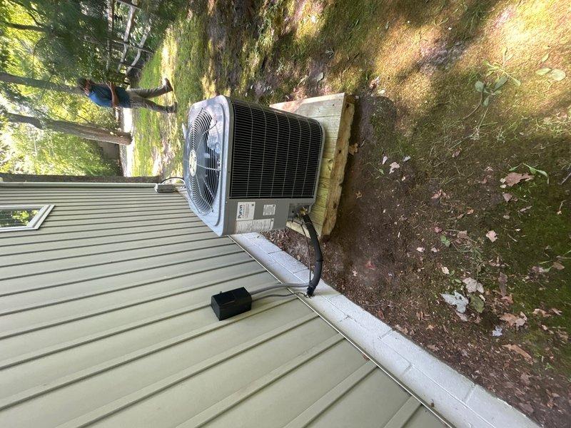 Completed full HVAC system replacement including removal and disposal of existing equipment. Installed new Carrier 27SCA536A003 3-ton 15 SEER heat pump outdoor unit on existing stand, Carrier FJ5ANXB36L00 air handling unit with ECM motor, and 10kw electric heat pack. Fabricated and installed metal duct transitions to adapt new equipment to existing ductwork. Replaced outdoor electrical disconnect and whip while reusing existing condensation drain and power lines. Installed Honeywell digital WiFi thermostat with filter at unit. System tested and operational with one-year PLAT extension activated from expiration date.