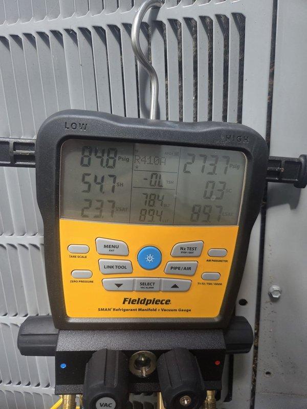 Responded to no cooling complaint with system running constantly and unable to reach setpoint temperature. Upon arrival, found thermostat displaying error message. Performed diagnostic testing using digital manifold gauges and measured system pressures and temperatures at the evaporator coil. Identified low refrigerant charge as primary issue affecting cooling capacity. System evaluation revealed pressures significantly below manufacturer specifications, preventing proper heat transfer and causing continuous compressor operation without adequate temperature reduction. Documented system conditions with diagnostic equipment readings and evaporator coil condition for service records.