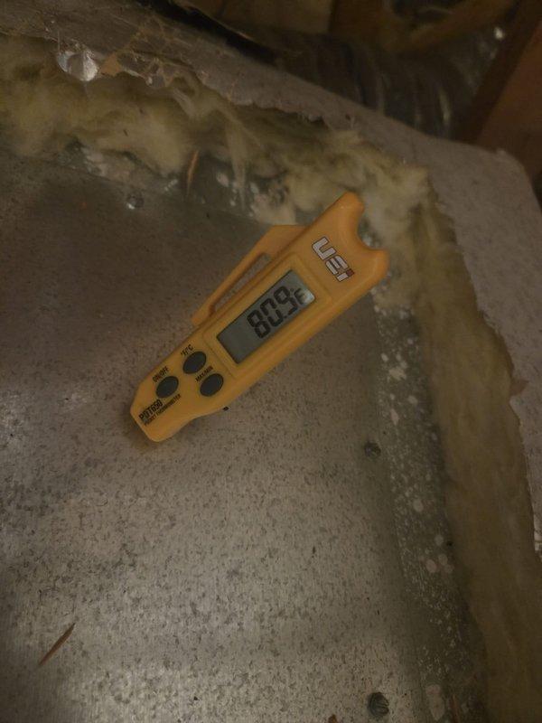 Responded to no cooling complaint on upstairs HVAC unit in residential property. Upon arrival, accessed property using provided entry instructions and proceeded to attic space to evaluate system performance. Conducted temperature diagnostics using digital thermometer at supply ductwork and measured airflow characteristics at flexible duct trunk line. Performed systematic troubleshooting of air conditioning system to identify cause of cooling failure. Documented findings with diagnostic measurements and photographic evidence of equipment conditions in attic installation area.