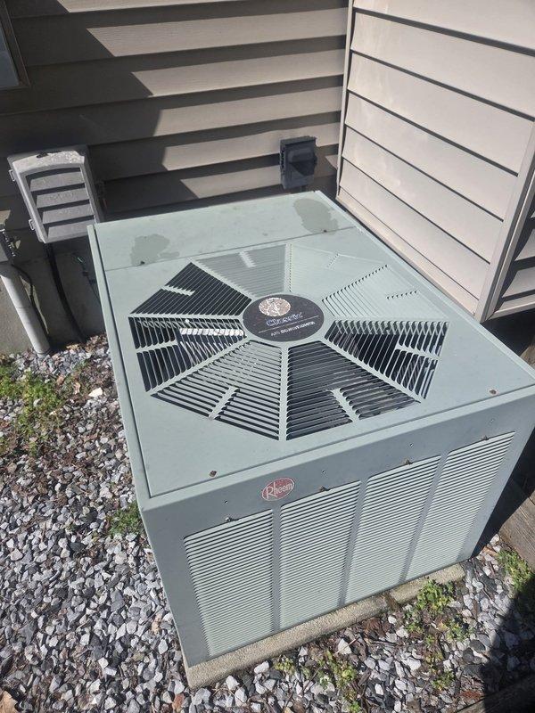 Responded to no cooling complaint on Rheem air conditioning system. Upon arrival, performed diagnostic evaluation of outdoor condensing unit and indoor air handler components. Inspected refrigerant lines, electrical connections, and system operation. Documented equipment condition with photographs showing outdoor unit positioned on concrete pad with proper clearances and indoor refrigerant line connections at air handler. System evaluated and restored to proper cooling operation.