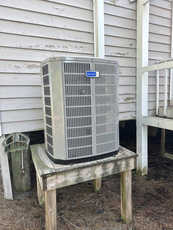 Completed full HVAC system replacement including removal and disposal of existing equipment. Installed 5A6H7036 3-ton 17 SEER heat pump outdoor unit on existing platform. Installed 5TEM6D04 variable speed fan coil unit with 15KW electric heater and breaker in drain pan with shutoff valve in attic space. Flushed, pressure tested, and recharged refrigeration lines to manufacturer specifications. Upgraded return air system by enlarging return flex duct to 16" diameter and increasing hall ceiling return register size to improve airflow and system efficiency. Installed 1" filter rack and THX1200W WiFi thermostat for enhanced system control. All equipment tested and operational upon completion.