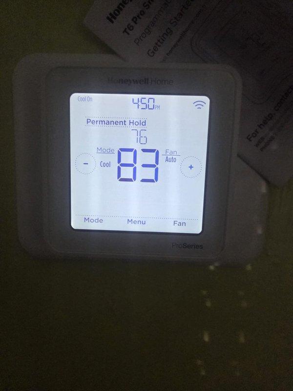 Responded to emergency service call for newly installed AC system producing abnormal sounds and failing to maintain setpoint temperature. Upon arrival, found thermostat displaying 83°F ambient temperature while set to 76°F cooling mode with permanent hold enabled. Performed diagnostic temperature measurements using calibrated digital thermometer, confirming elevated indoor temperatures of 88°F at supply registers. Identified and resolved airflow restriction issue preventing proper system operation. Verified system returned to normal cooling cycle, confirmed proper refrigerant charge levels, and tested all safety controls for proper operation on two-week-old installation.