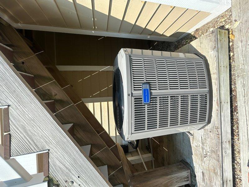 Completed full HVAC system replacement including removal and disposal of existing equipment. Installed American Standard 2-ton 14 SEER heat pump (model 5A6H4024A1000A) on existing outdoor stand beneath steps, American Standard air handler (model 5TEM4B03AC31) with 10 kw electric heat pack, 18.5" filter rack (model BAYSF1185), and Honeywell digital WiFi thermostat. Fabricated and installed metal duct transitions to adapt new equipment to existing ductwork. Reused existing condensate drain lines and repurposed electrical connections where applicable. Replaced outdoor disconnect and electrical whip to ensure code compliance and proper system operation. System tested and verified operational upon completion.