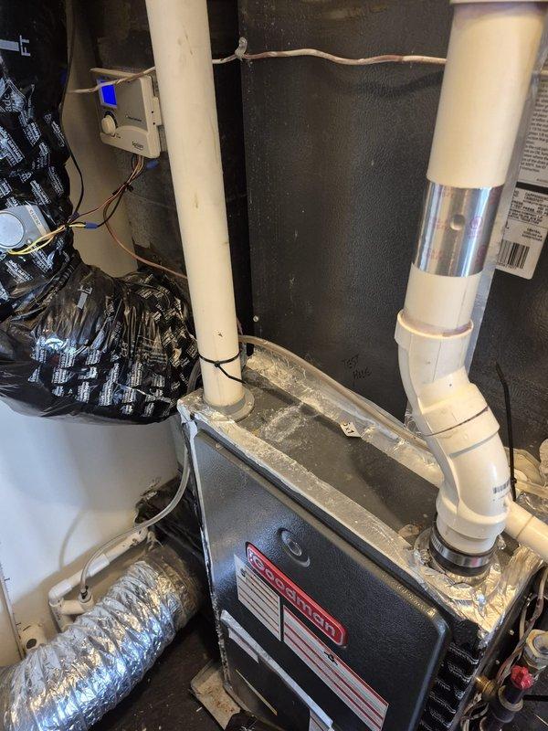 Responded to no cooling complaint on system less than 10 years old. Customer reported thermostat set at 72°F but reading 74°F currently, with previous day temperature reaching 80°F. System was cycling off intermittently and restarting on its own. Inspected furnace and air handler in mechanical room, verified PVC condensate drain lines and venting were clear and properly installed. Documented HVAC equipment configuration including ductwork and control wiring. Advised customer to turn system off at equipment while leaving thermostat powered on to prevent further cycling issues until repairs could be completed.