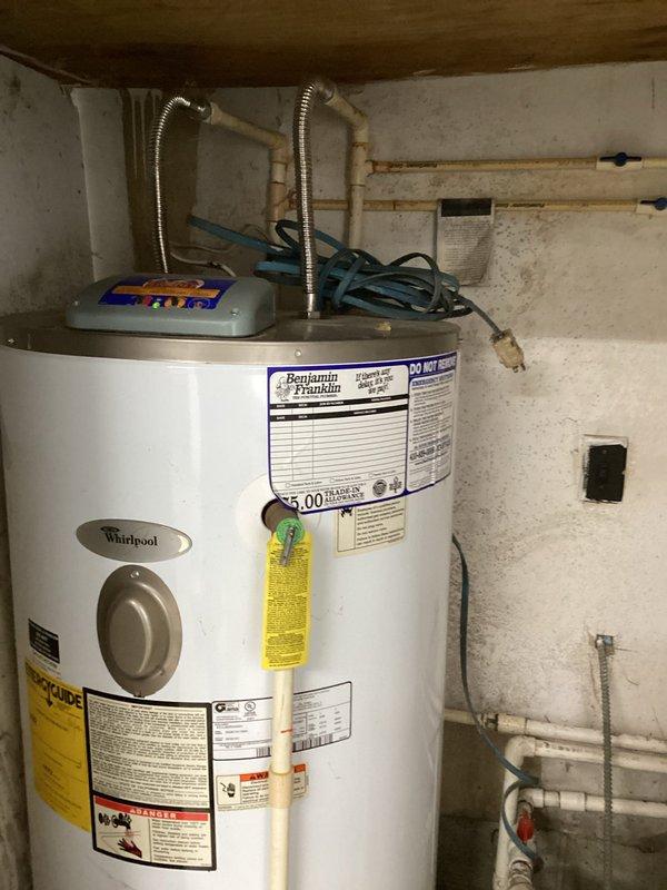 Conducted site assessment and prepared estimate for transitioning residential water supply from private well system to municipal water connection. Evaluated existing plumbing infrastructure including water heater installation and exterior service entry point to determine scope of work required for municipal water hookup. Documented current system configuration and connection points to provide accurate pricing for connecting home to town water supply.