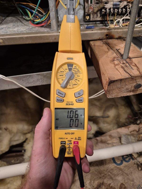 Performed cooling system maintenance and diagnostic evaluation. Used psychrometer to measure temperature and humidity levels, and tested electrical components with multimeter, recording 10.6 amps and 88 volts at the unit. System operational upon completion of inspection.