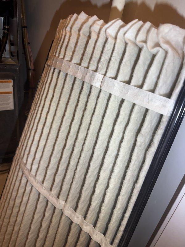 Responded to no cooling complaint on residential HVAC system. Customer reported unit running continuously, thermostat set to 75°F unable to maintain temperature, and stuffy air quality requiring supplemental fan usage. Upon inspection, measured supply air temperature at 117.5°F, indicating complete loss of cooling capacity. Diagnosed severely restricted airflow due to dirty air filter causing reduced system performance and inadequate air circulation. Replaced air filter with clean pleated media filter from customer's on-site inventory. System airflow restored, cooling capacity returned to normal operation, and indoor air quality improved.