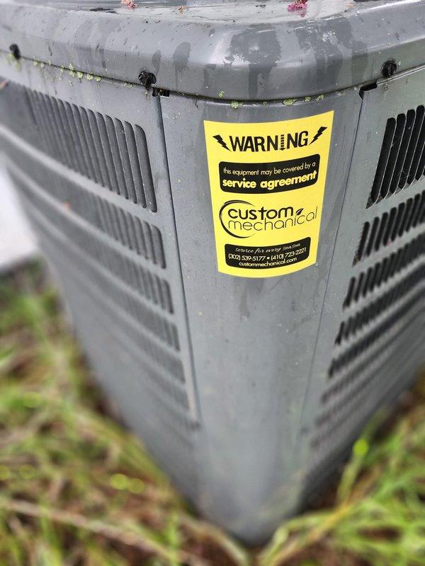 Performed routine tune-up and inspection on residential cooling system. Verified thermostat operation and left set to 78°F cooling mode. Applied company identification stickers to HVAC equipment and water heater per homeowner request for upcoming property sale to ensure new owners have service contact information.