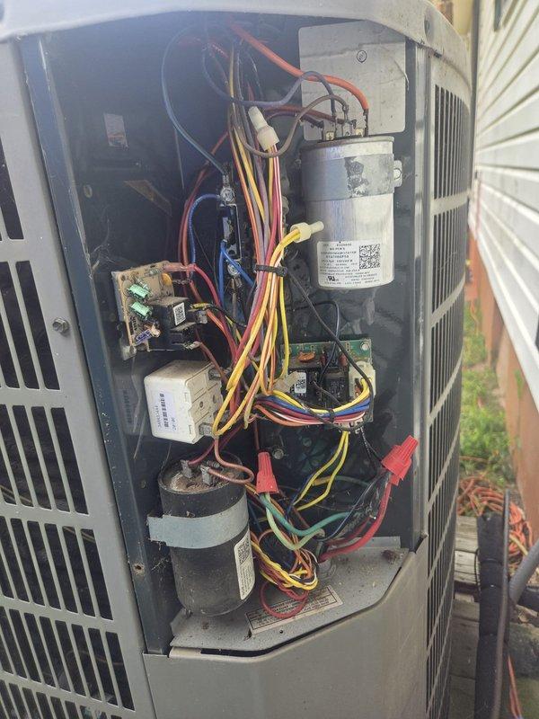 Performed routine cooling system maintenance on residential outdoor condenser unit. Inspected electrical components including capacitor, wiring connections, and control board; all tested within normal operating parameters. Observed moderate rust and corrosion on fan motor hub assembly; monitored for future service needs but unit currently operating efficiently.